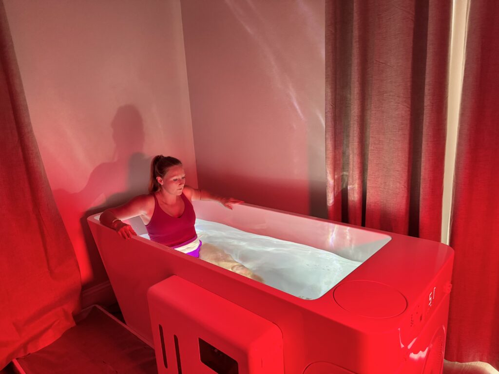 Person enjoying cold plunge therapy session at The Salt Caves of Lakewood Ranch
